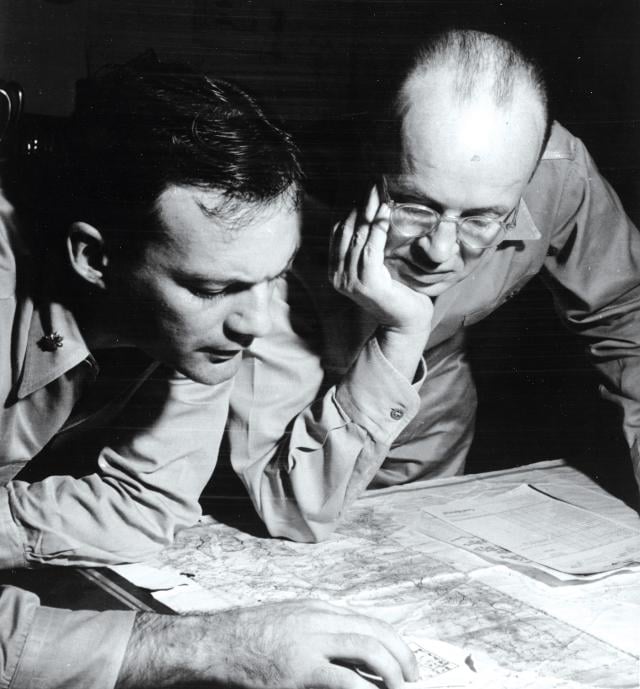 Physical maps, such as the one being used here by Admiral William “Bull” Halsey’s intelligence officers during World War II, can display a geographic area in its entirety at a resolution and a relative size that most computers and screens cannot match.