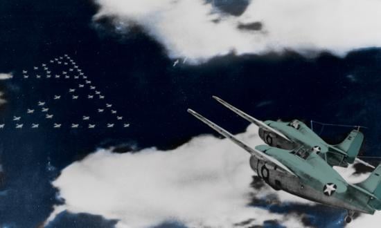 A pair of F4F-3 Wildcat fighters of Marine Aircraft Group (MAG) 22 head toward the enemy’s formation of Midway-bound bombers early on 4 June 1942.  Of MAG-22’s 26 fighter pilots who took off that morning, 14 later would be missing in action.